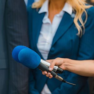 Media interview, a politician at media press conference.