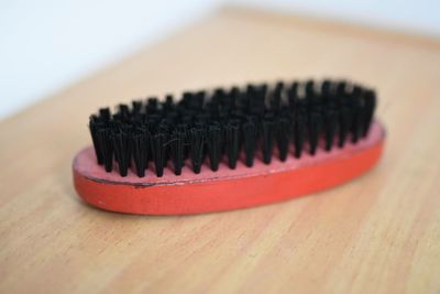 Close-up of brush on table