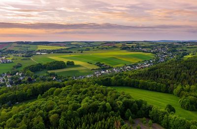 Aerial view over fields, meadows and forest near the town hartenstein, germany