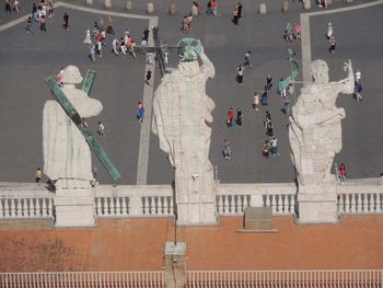 High angle view of people standing in city