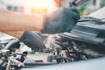 Cropped image of man repairing car