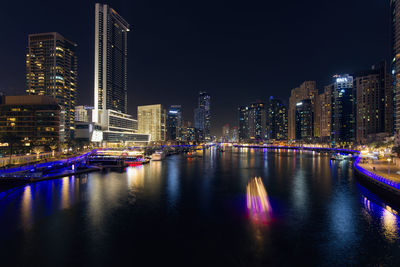 Illuminated buildings in city at night