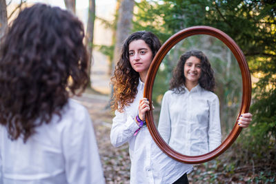 Portrait of teenage girl standing outdoors