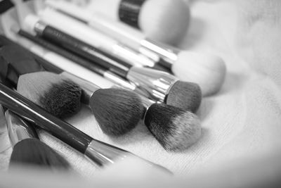 Close-up of make-up brushes on table