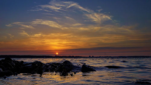 Scenic view of sea against sky during sunset