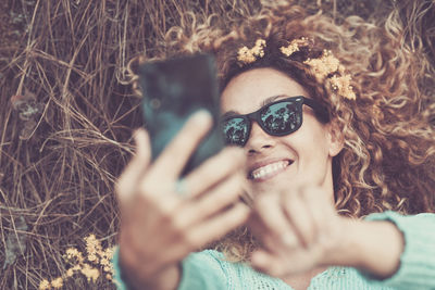 High angle view of woman taking selfie outdoors