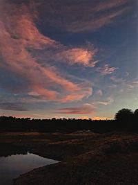 Scenic view of lake against sky during sunset