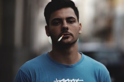 Portrait of man smoking cigarette