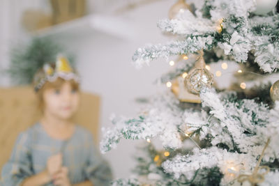Portrait of woman with christmas tree