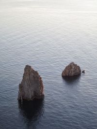 High angle view of rocks in sea