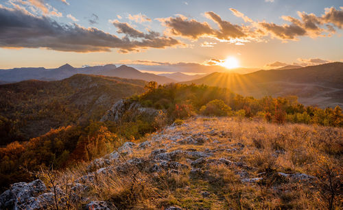 Scenic view of mountains against sky during sunset