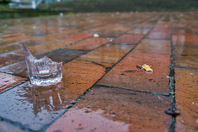 Close-up of wet glass on table