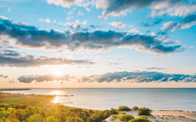 Scenic view of sea against sky during sunset