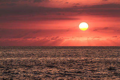 Seascape against sky during sunset