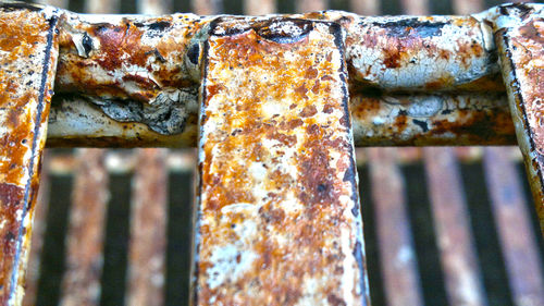 Close-up of old rusty metal railing