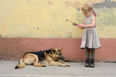 Girl with dog on street