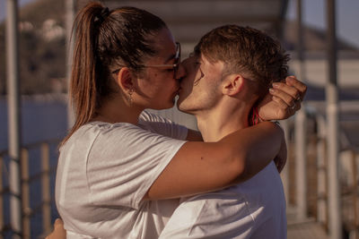 Side view of young couple outdoors