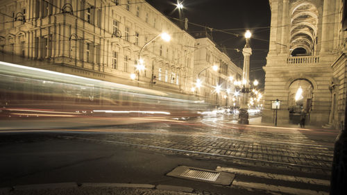 Illuminated city street at night