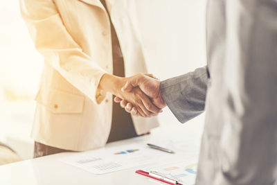 Close-up of business people shaking hands