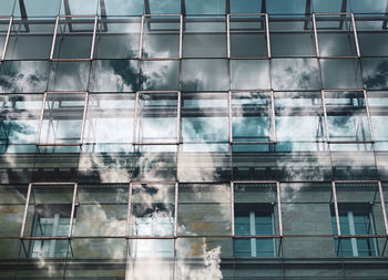 Reflection of building on glass window