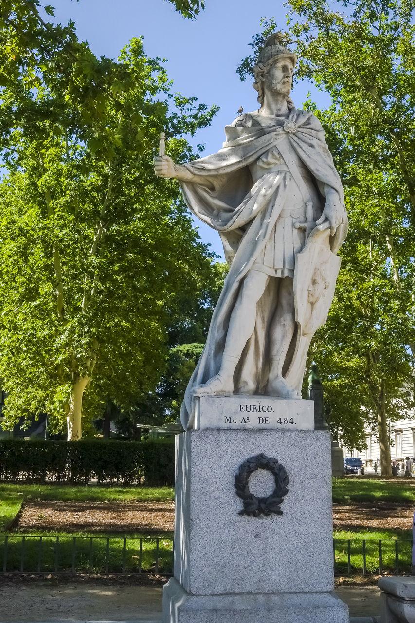 sculpture, statue, tree, plant, human representation, architecture, representation, no people, nature, art, day, monument, park, park - man made space, craft, male likeness, travel destinations, memorial, sky, outdoors, history, the past, creativity, city, religion, travel, built structure