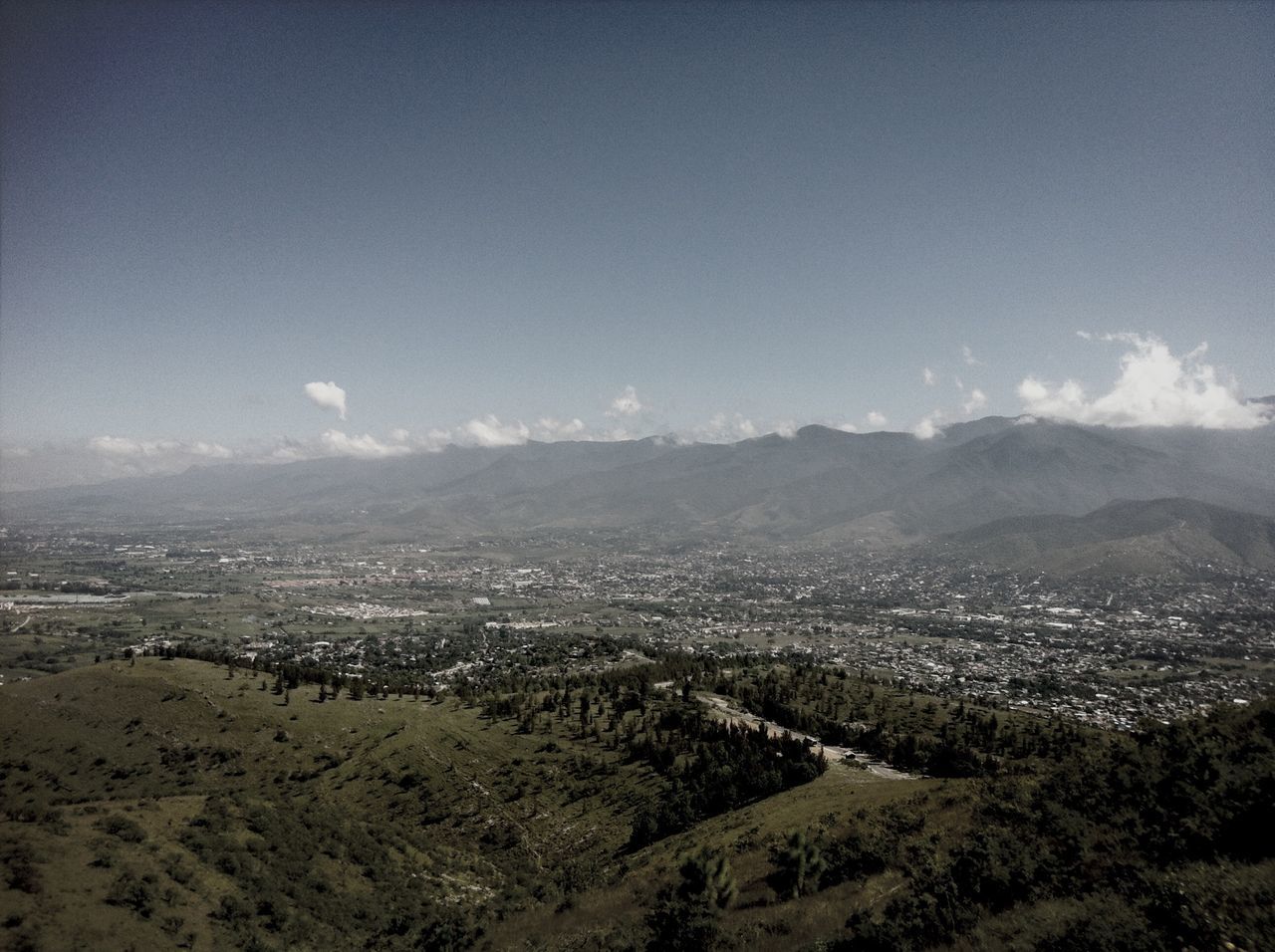 mountain, landscape, sky, cityscape, scenics, building exterior, mountain range, high angle view, aerial view, city, built structure, architecture, tranquil scene, beauty in nature, nature, cloud - sky, tranquility, crowded, residential district, horizon over land