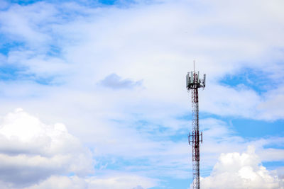 Low angle view of communications tower against sky