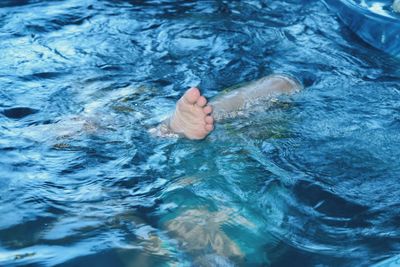 Close-up of hand in water