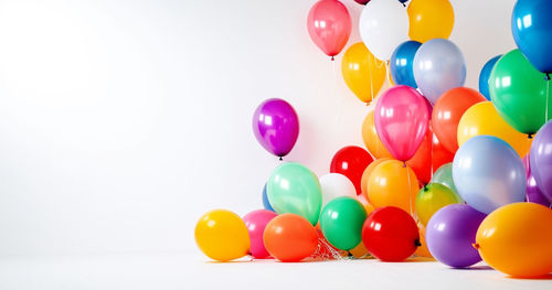 Close-up of balloons against white background