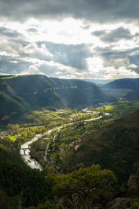 Aerial view of valley and mountains against sky