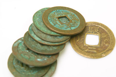 Close-up of coins on white background