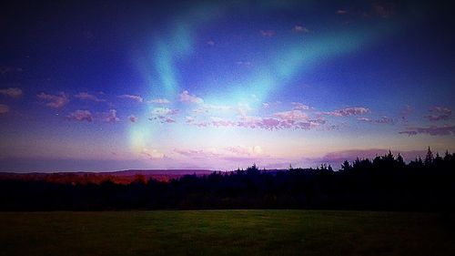 Scenic view of landscape against sky at night