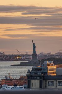 Statue of liberty against sky during sunset