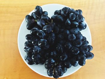 High angle view of berries in plate on table