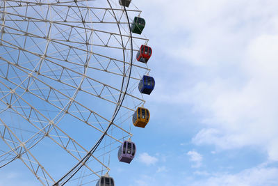 Low angle view of ferris wheel against sky