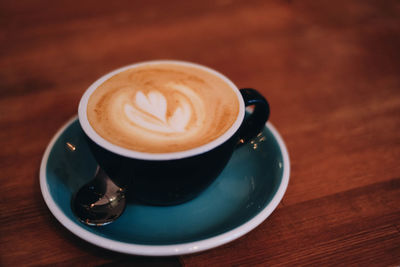 Close-up of cappuccino on table