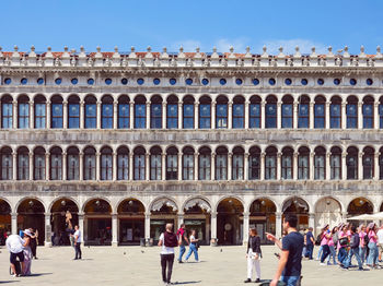 People in front of historic building