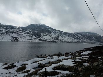 River passing through snow covered mountains