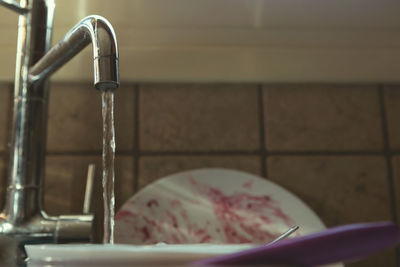 Close-up of faucet in bathroom