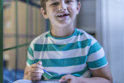 Close-up of boy using tablet