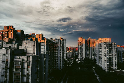 Panoramic view of buildings in city against sky