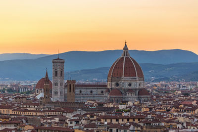 High angle view of city buildings at sunset