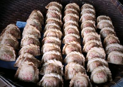 High angle view of meat on barbecue grill
