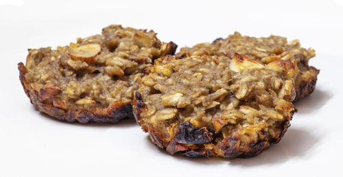 Close-up of burger against white background