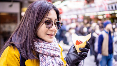 Portrait of young woman wearing sunglasses