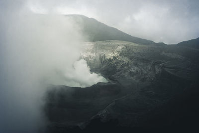 Smoke emitting from volcanic mountain