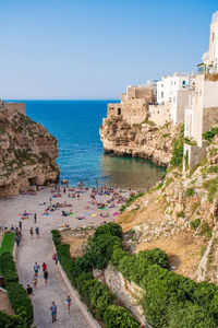 Panoramic cityscape of polignano a mare town on the rocks and beach, puglia region, italy, europe