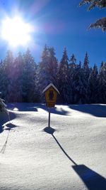 Snow covered landscape against sky