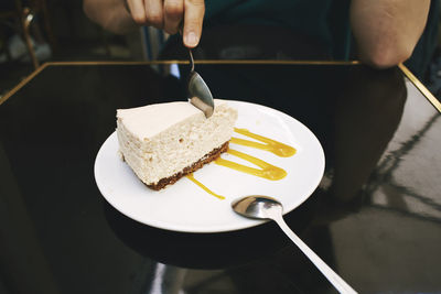 Close-up of hand holding ice cream cone
