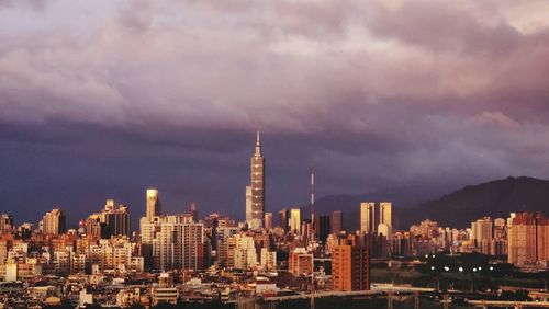 Cityscape against sky during sunset